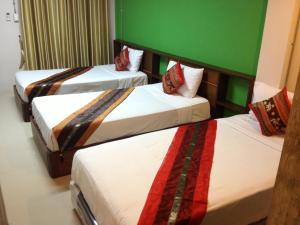 Ein Bett oder Betten in einem Zimmer der Unterkunft City Ratsada Apartment