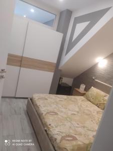 מיטה או מיטות בחדר ב-CASETTA DEL SARACENO