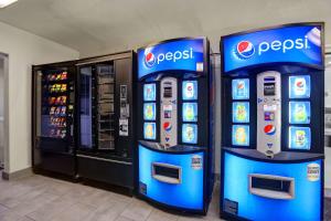 two pepsi machines in front of a store at Motel 6-San Bernardino, CA - North in Serrano Village