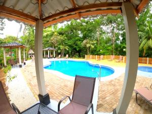 A piscina localizada em El Sueno Tropical Hotel ou nos arredores