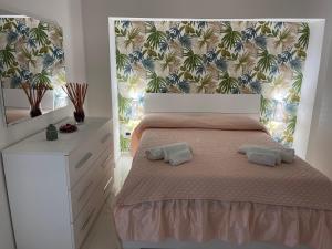 Posteľ alebo postele v izbe v ubytovaní Partenope&Ulisse House Napoli