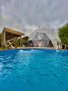 a large tent in front of a swimming pool at Sapanca Green Dome in Sapanca