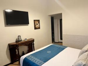 Cama ou camas em um quarto em Katari at Plaza de Armas Cusco