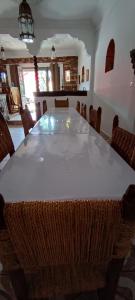 a large table in a room with chairs around it at Titrite Ouzoud in Ouzoud