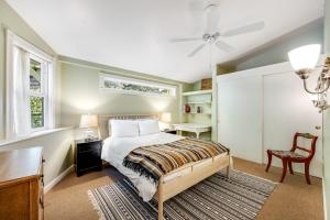 a bedroom with a bed and a desk and a window at Cloverdale Creekside Retreat in Cloverdale