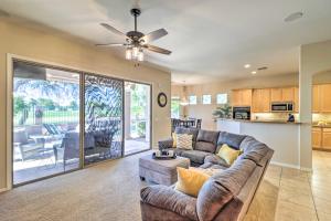 a living room with a couch and a ceiling fan at Goodyear Home on Golf Course Pool and Putting Green in Goodyear