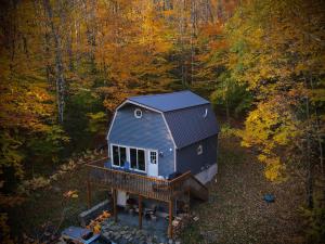 an aerial view of a tiny house in the woods at Mandy's Mountain Chalet in Dover