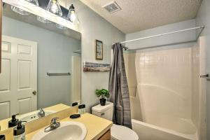 a bathroom with a sink and a toilet and a shower at Deltona Retreat with Yard and Grill Pets Welcome! in Deltona +26 photos