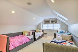 a bedroom with two beds and a couch at Luxe Sandy Home with Hot Tub 9 Mi to Skiing! in Sandy