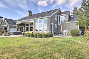 a house with a patio and a yard at Luxe Sandy Home with Hot Tub 9 Mi to Skiing! in Sandy