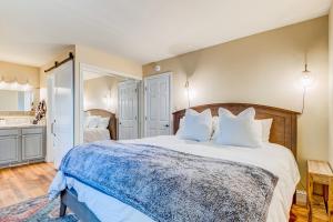 a bedroom with a large bed with white pillows at Incline Village Charmer in Incline Village