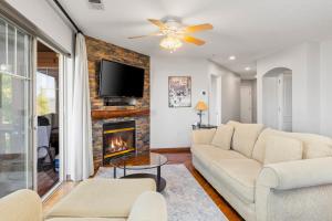 a living room with a couch and a fireplace at Jordanelle Jubilee in Heber City