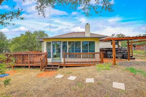 a home with a large deck and a house at Stargazer Ranch in Dripping Springs