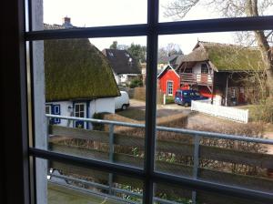 a view from a window of a village at Pension Martens - Mansadenwohnung in Wieck