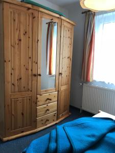 Ένα ή περισσότερα κρεβάτια σε δωμάτιο στο Pension Martens - Jana +3 φωτογραφίες