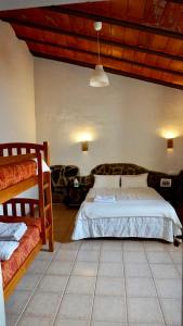 מיטה או מיטות בחדר ב-Casa Indiano