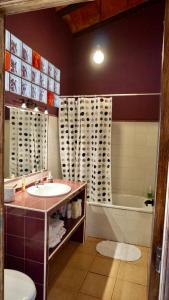 a bathroom with a sink and a tub at Casa Indiano 