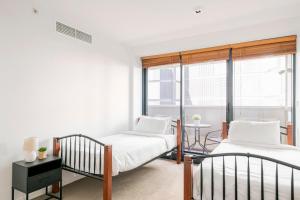 Ένα ή περισσότερα κρεβάτια σε δωμάτιο στο Luxury 3-Storey Loft with free parking on premises