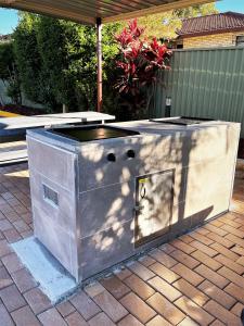 a large metal box sitting on a patio at Jetty Motel The Entrance in The Entrance