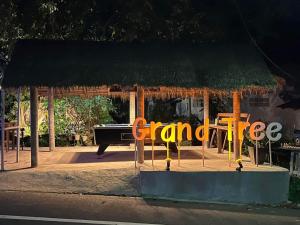 a sign that says grand tree in front of a store at Grand Tree in Ko Chang