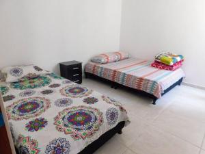 Tempat tidur dalam kamar di Montenegro apartamento Completo