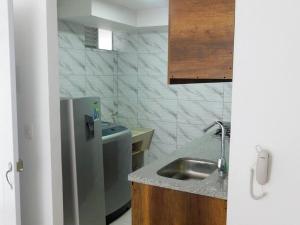 Dapur atau dapur kecil di Montenegro apartamento Completo