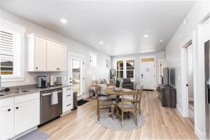 a kitchen and living room with a table and chairs at Charming 3-bedroom in vibrant new neighborhood in Billings