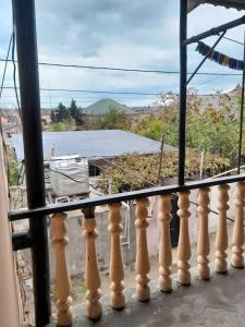 a balcony with a view of a house at 2-storey apartment in Mardakan