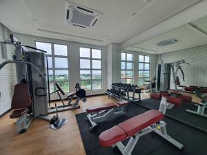 a gym with a lot of treadmills and machines at SKS Habitat Larkin Economy Business Unit in Johor Bahru