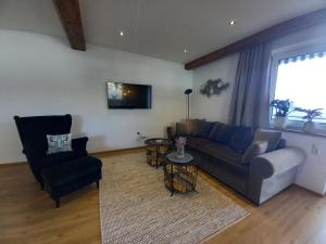Televízia a/alebo spoločenská miestnosť v ubytovaní Panorama Appartements Filzerhof