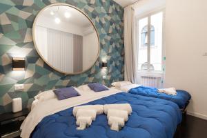 Łóżko lub łóżka w pokoju w obiekcie Trastevere four seasons Manara
