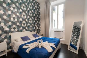Łóżko lub łóżka w pokoju w obiekcie Trastevere four seasons Manara