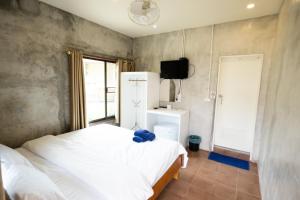 Ένα ή περισσότερα κρεβάτια σε δωμάτιο στο Mimo Guesthouse
