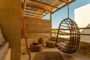 a room with a hammock and a window at Meli Suites Isle - Adults Only in Skala Potamias