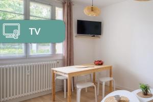 TV a/nebo společenská místnost v ubytování Appartement Cosy Lyon Ouest Tassin
