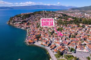 una vista aérea de una ciudad con un gran cartel en Darija Apartments - City Square, en Ohrid