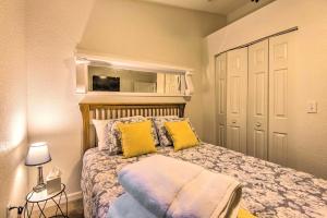 a bedroom with a bed with two yellow pillows at St Charles Hilltop Mansion with Mod Interior! in Hanley +18 photos