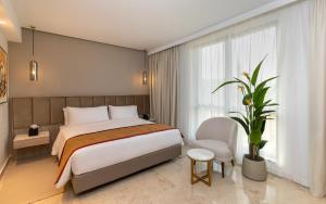 Postel nebo postele na pokoji v ubytování Hotel Royal ASBU Tunis