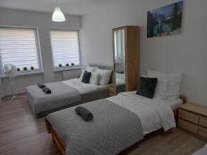 Säng eller sängar i ett rum på Apartament River Skierniewice