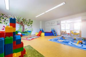 a childs play room with colorful blocks and toys at Hotel Am Bühl in Eibenstock