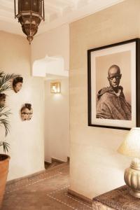 a room with a picture of a man on the wall at Riad RK Suites & Spa in Marrakesh