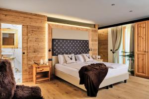 Postel nebo postele na pokoji v ubytování Boutique Hotel e Chalets Salvadori + 37 fotografií