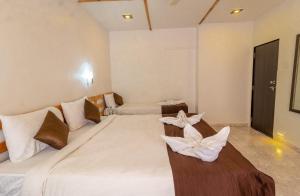 Postel nebo postele na pokoji v ubytování Saga Resort