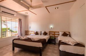 Postel nebo postele na pokoji v ubytování Saga Resort
