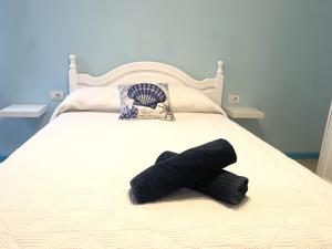 Łóżko lub łóżka w pokoju w obiekcie APARTAMENTO AZUL