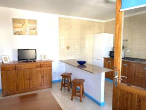 Telewizja i/lub zestaw kina domowego w obiekcie APARTAMENTO AZUL