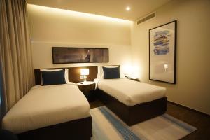 Gulta vai gultas numurā naktsmītnē C - Hotel and Suites Doha