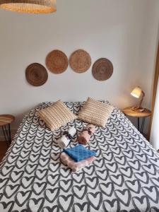 a bed with a picture of a person on it at Large apartment near the beaches of Mourillon in Toulon
