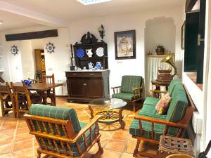 a living room with a couch and chairs and a table at Las maravillas de Manuel By Solymar Holiday in Málaga