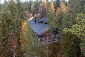 an aerial view of a house in the middle of a forest at Katasijan Villa in Salla